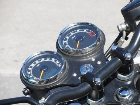 Motorcycle dash display instruments with speedometer and tachometer Stock Photos