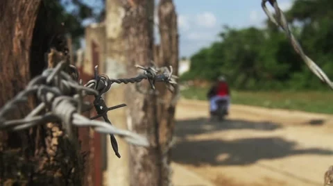 Motorcycle on Dirt Road in Third World Country Stock Footage 47857872