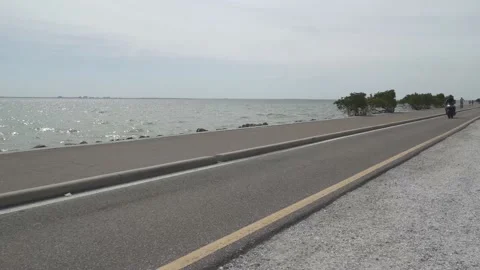 Motorcycle Drive By Ocean Video stock 168632839