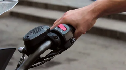 The motorcycle driver presses the throttle stick with sound Stock Footage 81202552