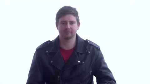 Motorcycle driver puts on his helmet Stock Footage 73723547