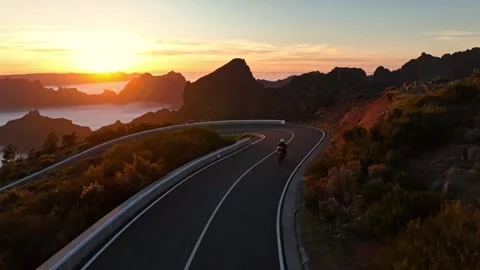 Motorcycle Driver Riding in High Mountain Landscape. Stock Footage 308090578