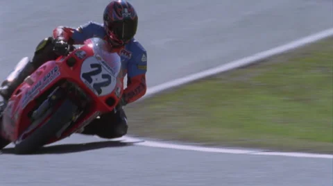 A motorcycle drives on a circuit track. Stock Footage 4941992