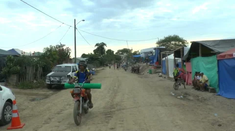 Motorcycle Drives Down Dirt Road Stock-Footage 63746217