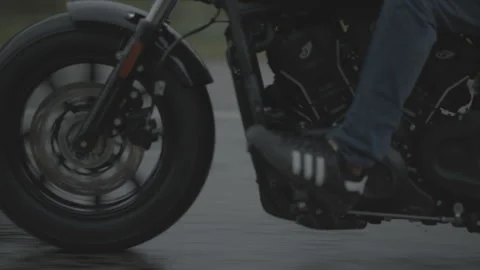 Motorcycle drives on the road, rainy, closeup details on tire Stock Footage 323478166