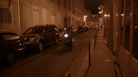 Motorcycle Drives Through an Empty Paris Street at Night Stock Footage 47209334