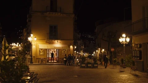 Motorcycle driving in Cefalu at night Stock Footage 88520115