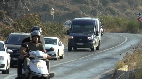 Motorcycle Driving Into A lay by Hillside Road Stock-Footage 104985306