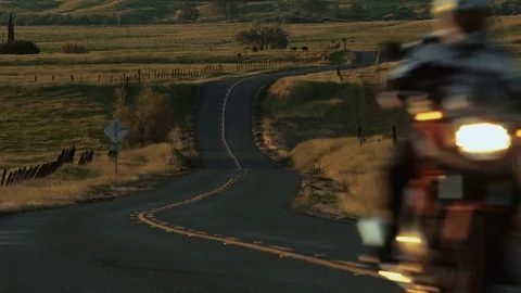 Motorcycle Driving on Open Road Stockbeeldmateriaal 73754105