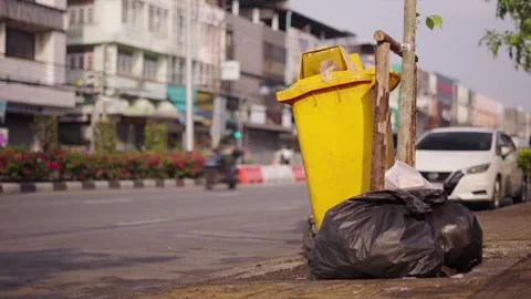 Motorcycle driving in the wrong direction on a busy street in Bangkok next to a Stock Footage 278292931