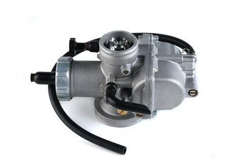 Motorcycle engine aluminum carburetor assembly with adjustment screw isolat.. Stock Photos