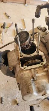 Motorcycle engine being repaired and disassembled Stock Photos