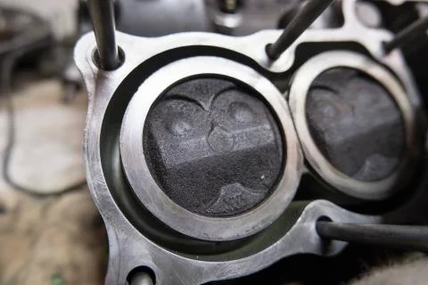 Motorcycle engine disassembled, visible pistons Stock Photos