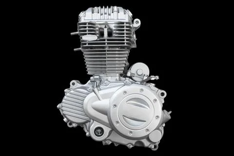 Motorcycle engine isolated on black background. Air cooled internal combust.. Foto stock
