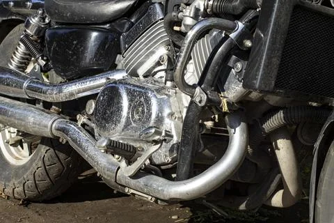 Motorcycle engine in mud and water stains Stock Photos