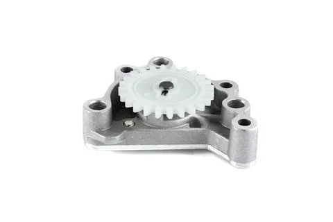 Motorcycle engine oil pump assembly with plastic drive gear isolated on white Stock Photos
