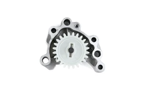 Motorcycle engine oil pump assembly with plastic drive gear isolated on whi.. Stock Photos