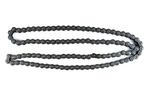Motorcycle engine steel roller timing drive chain replacement hardware loop.. Stock Photos