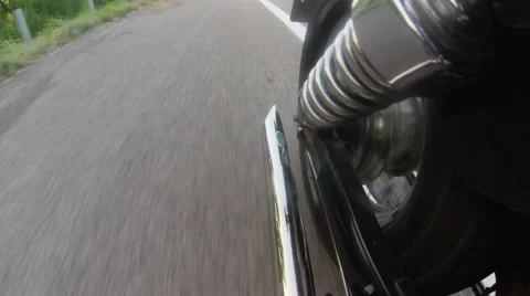 Motorcycle exhaust pipe while driving. Close up Stock Footage 65259501