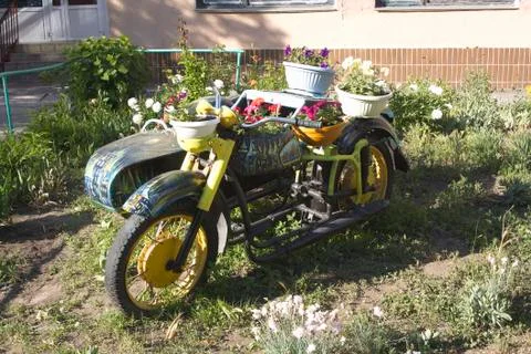Motorcycle with flowers Stock Photos