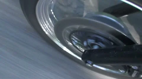 Motorcycle front tyre going fast shadows - HD 720 PAL Stock Footage 10877945
