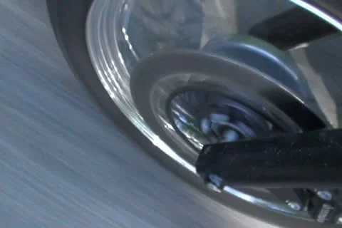 Motorcycle front tyre going fast shadows - SD NTSC Stock Footage 10877956
