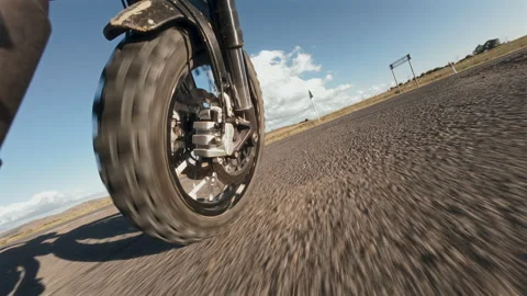 Motorcycle Front Wheel Rolling Forward on Empty Road Video stock 323563108