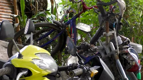 Motorcycle graveyard in Jungle Stock-Footage 66185944