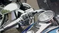 Motorcycle handlebars with drops of rain, demonstration and test drive of bikes HD Footage