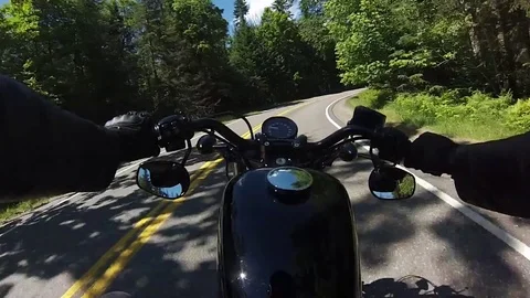 Motorcycle harley davidson chest mount view through forest curve Stock Footage 71105312