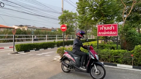 Motorcycle lessons driving school stop sign at intersection, rider turn left Video stock 186913959