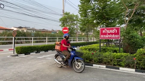 Motorcycle lessons driving school stop sign at intersection, rider turn left Video stock 186913961