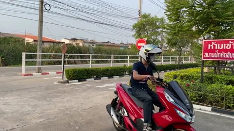 Motorcycle lessons driving school stop sign at intersection, rider turn left Video stock 186914238