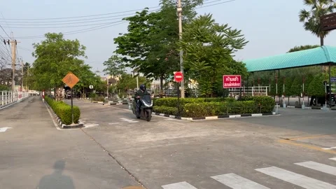 Motorcycle lessons driving school stop sign at intersection, rider turn left Video stock 186914417