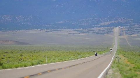 Motorcycle on long road Vídeos de archivo 54557152