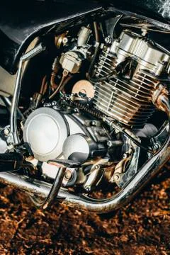 Motorcycle. the main part of the engine. there is dirt on it. close-up. there Stock Photos