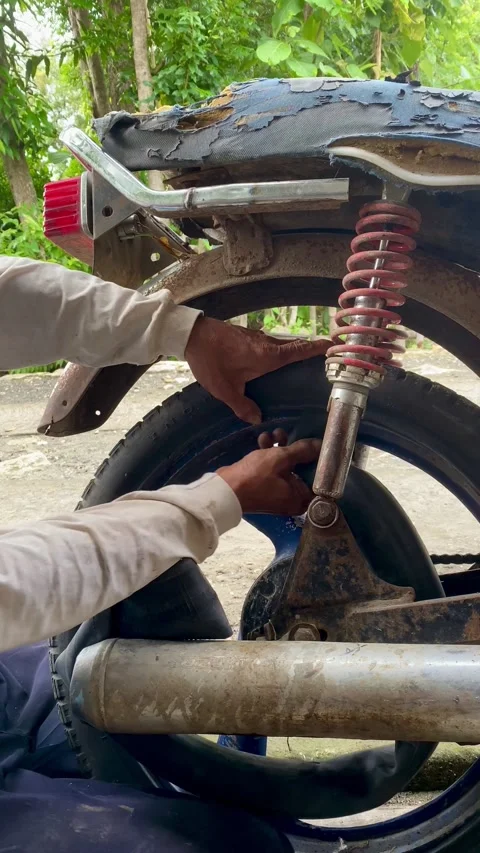 Motorcycle Mechanic Changing Tire Stock Footage 324896729