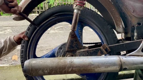 Motorcycle Mechanic Changing Tire Stock Footage 324896734