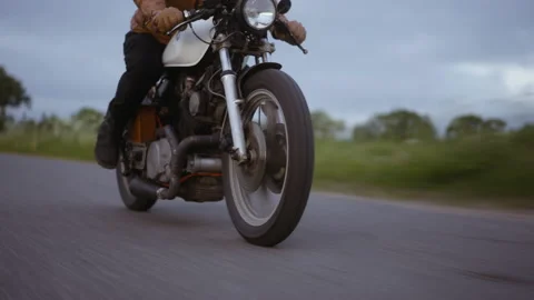 Motorcycle in the Middle of a Road With the Glimpse of the Gray Skies Video stock 157370233