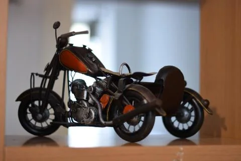 Motorcycle model on a library. Stock Photos