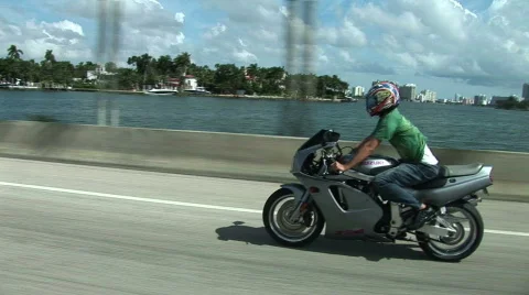 Motorcycle next to Intercoastal2 Stock Footage 756769