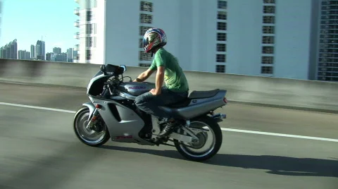 Motorcycle Over Bridge Stock Footage 756765