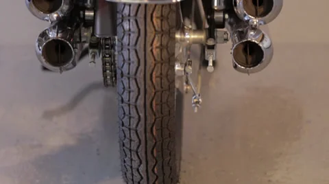 Motorcycle pan up from rear with blinker on Stock Footage 34333189