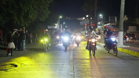 Motorcycle parade with costumed riders during Day of the Dead celebration. Video stock 337916295