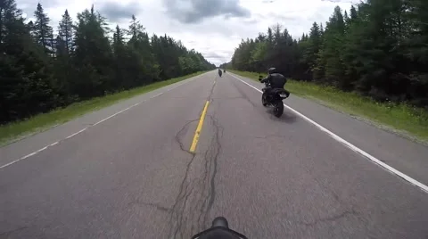Motorcycle passing another rider Stock Footage 56565130
