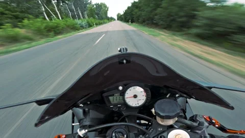 Motorcycle POV Fast Turn on Tree-Lined Road Stock Footage 327687009