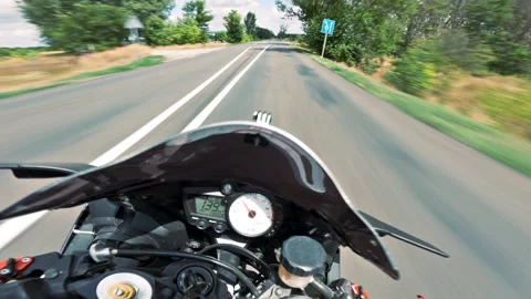 Motorcycle POV Turn Through Tree Lined Road Stock Footage 327686985