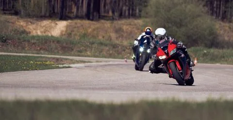 Motorcycle practice leaning into a fast corner on track Foto stock