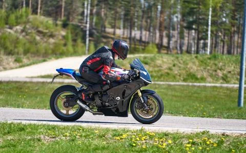 Motorcycle practice leaning into a fast corner on track Fotos Stock