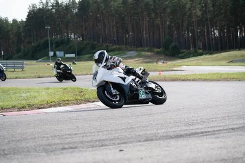 Motorcycle practice leaning into a fast corner on track Fotos de archivo